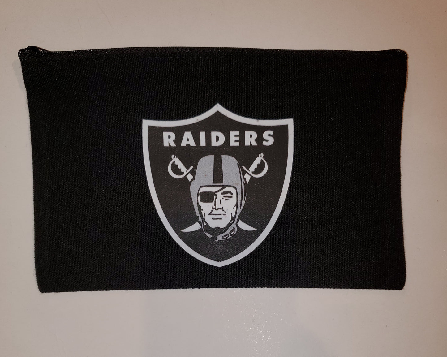 Football  Black 8.3 x 5 inch zipper bag.