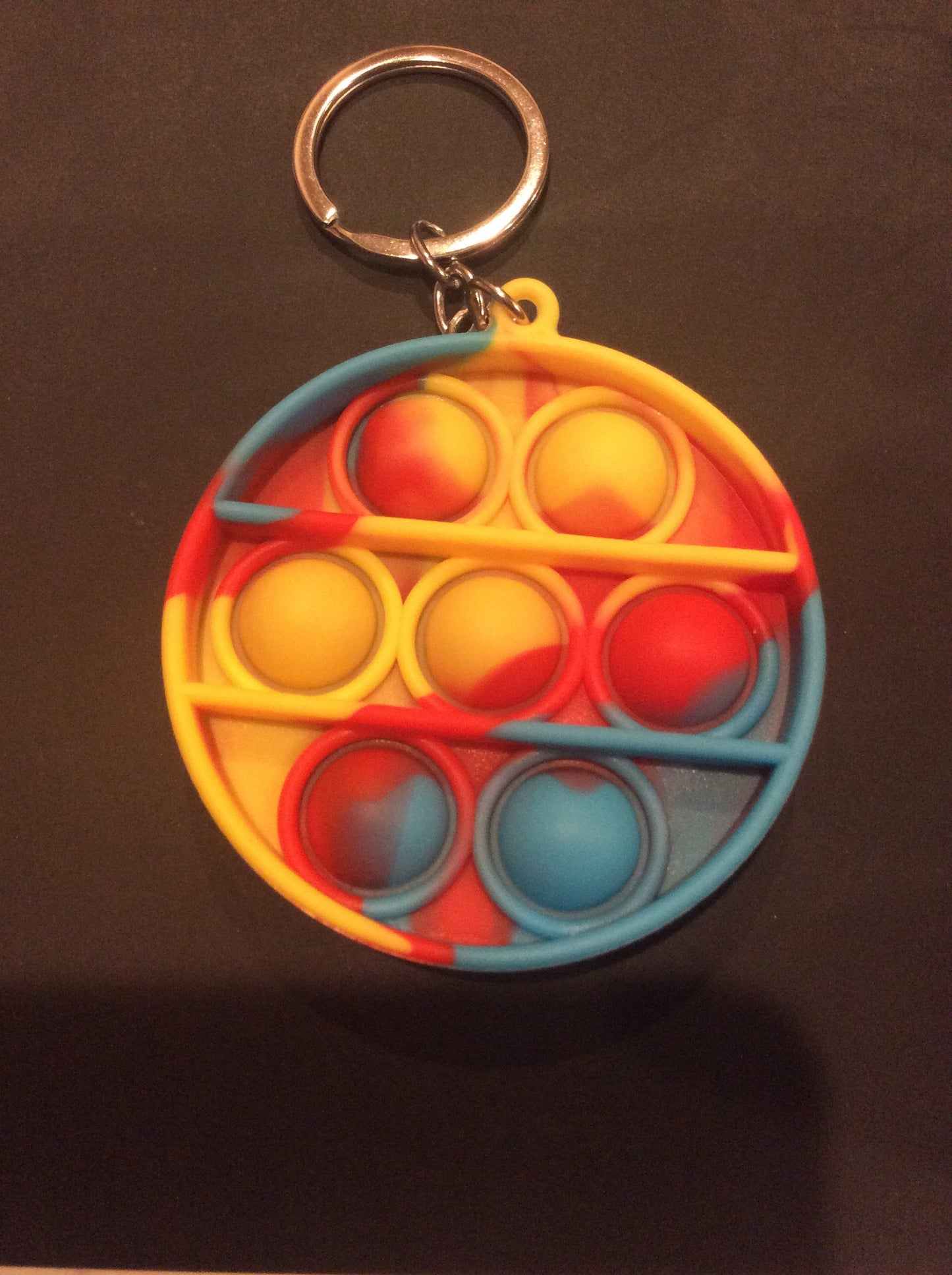 Circle Red, Yellow and Blue Bubble Pop It Fidget Keychain Approximately 2.5 inches tall